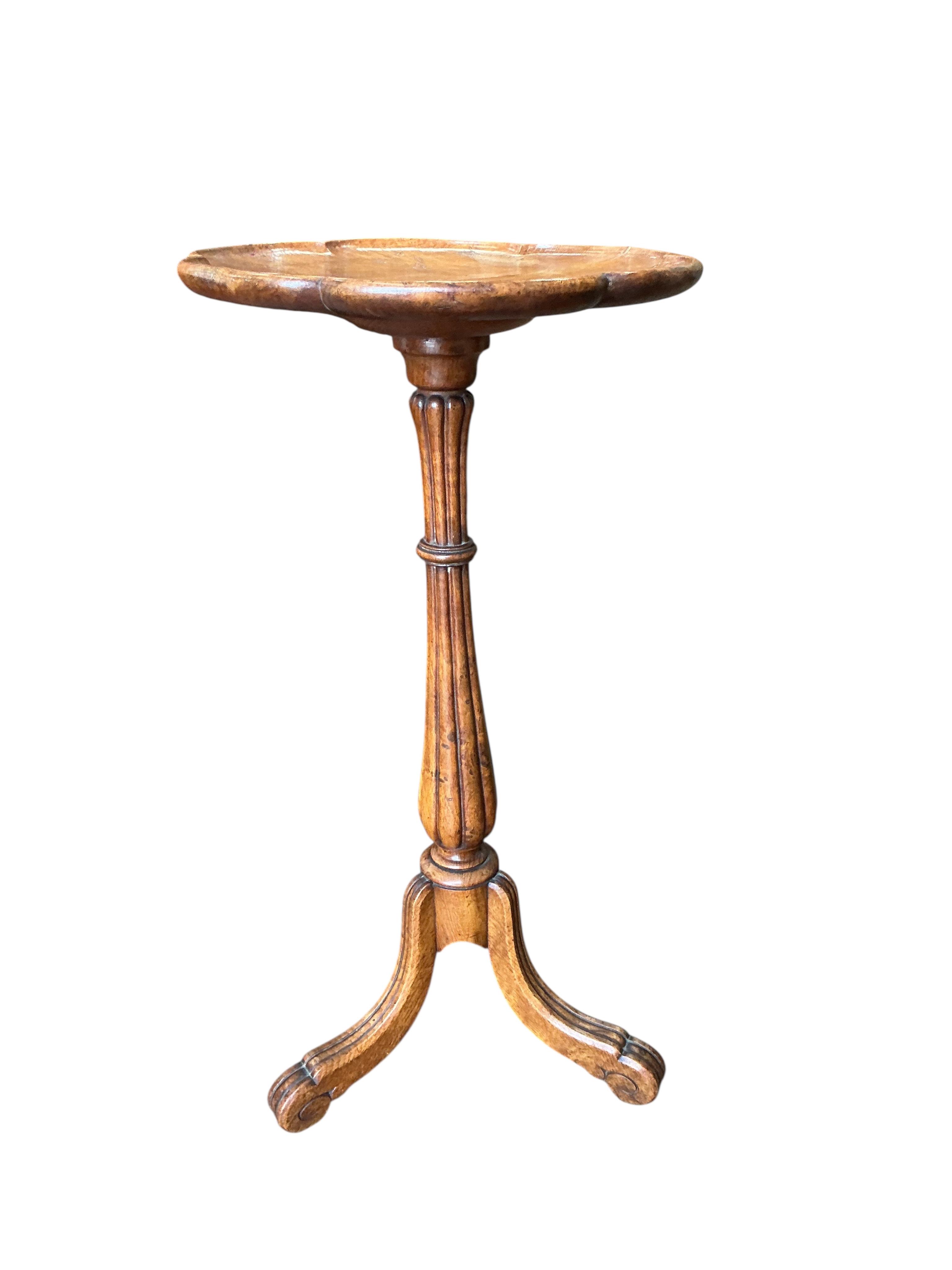 A Victorian circular elm tripod wine table, diameter 36cm, height 72cm